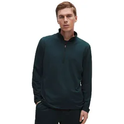 A man is wearing a dark long-sleeve, quarter-zip pullover paired with matching pants, both in a casual style.