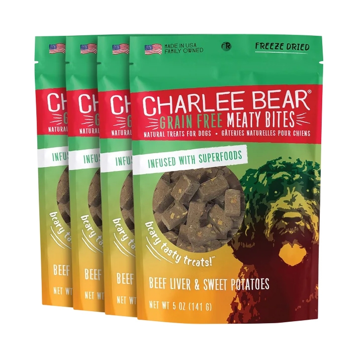 Four packages of Charlee Bear Grain Free Meaty Bites dog treats in Beef and Beef Liver & Sweet Potatoes flavors, freeze-dried and infused with superfoods.