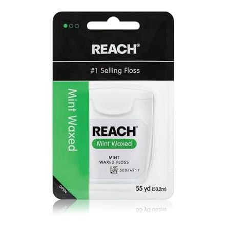 Reach Mint Waxed Floss, 55 yards (50.2m), in a black and green package labeled as the \“#1 Selling Floss\“.
