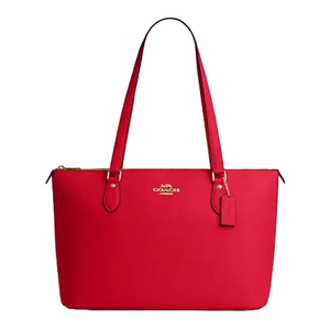 Bright red Coach Gallery Tote with dual shoulder straps, gold-tone logo and tag, zippered top, and minimalist design.
