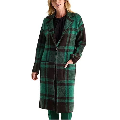 A long, green and brown plaid coat worn by a person, featuring a single button closure and two pockets.