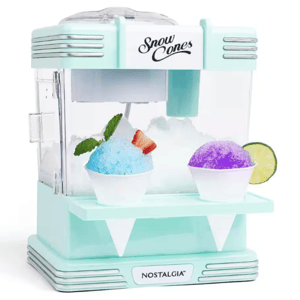 Nostalgia snow cone machine in mint green with two snow cones—one blue with a mint garnish and strawberry, and one purple with a lime slice.