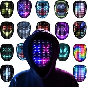 A person is wearing a hooded sweatshirt and a mask with LED lights that can display various digital patterns and designs across the mask's surface. Several LED masks with different illuminated colors and expressions surround the central figure.