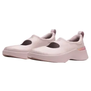 A pair of pink slip-on shoes with a wide strap and rounded design, featuring a low platform sole and a loop at the heel for easy wear.