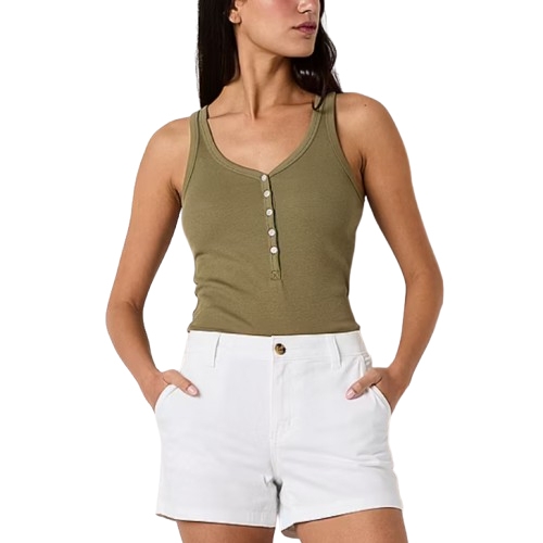 A woman wears a sleeveless olive green henley tank top with white shorts, featuring a button detail on the top and side pockets on the shorts.