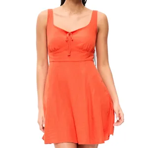 A sleeveless orange dress with a fitted bodice, scoop neckline, tie detail at the bust, and a flared skirt.