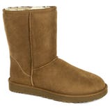 A brown suede boot with a flat sole, featuring visible stitching and a soft, plush interior lining.