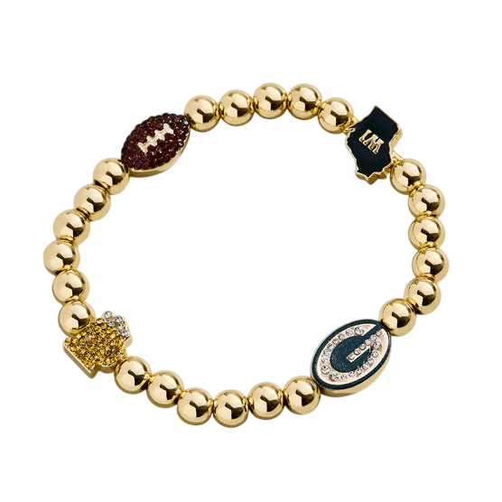 A gold beaded bracelet featuring charms, including a football, a map with initials, a crown, and a gem-studded oval.
