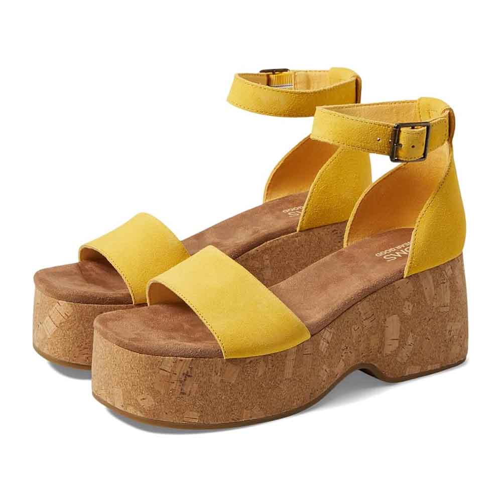 Yellow platform sandals with cork wedge heels and ankle straps featuring a buckle closure.