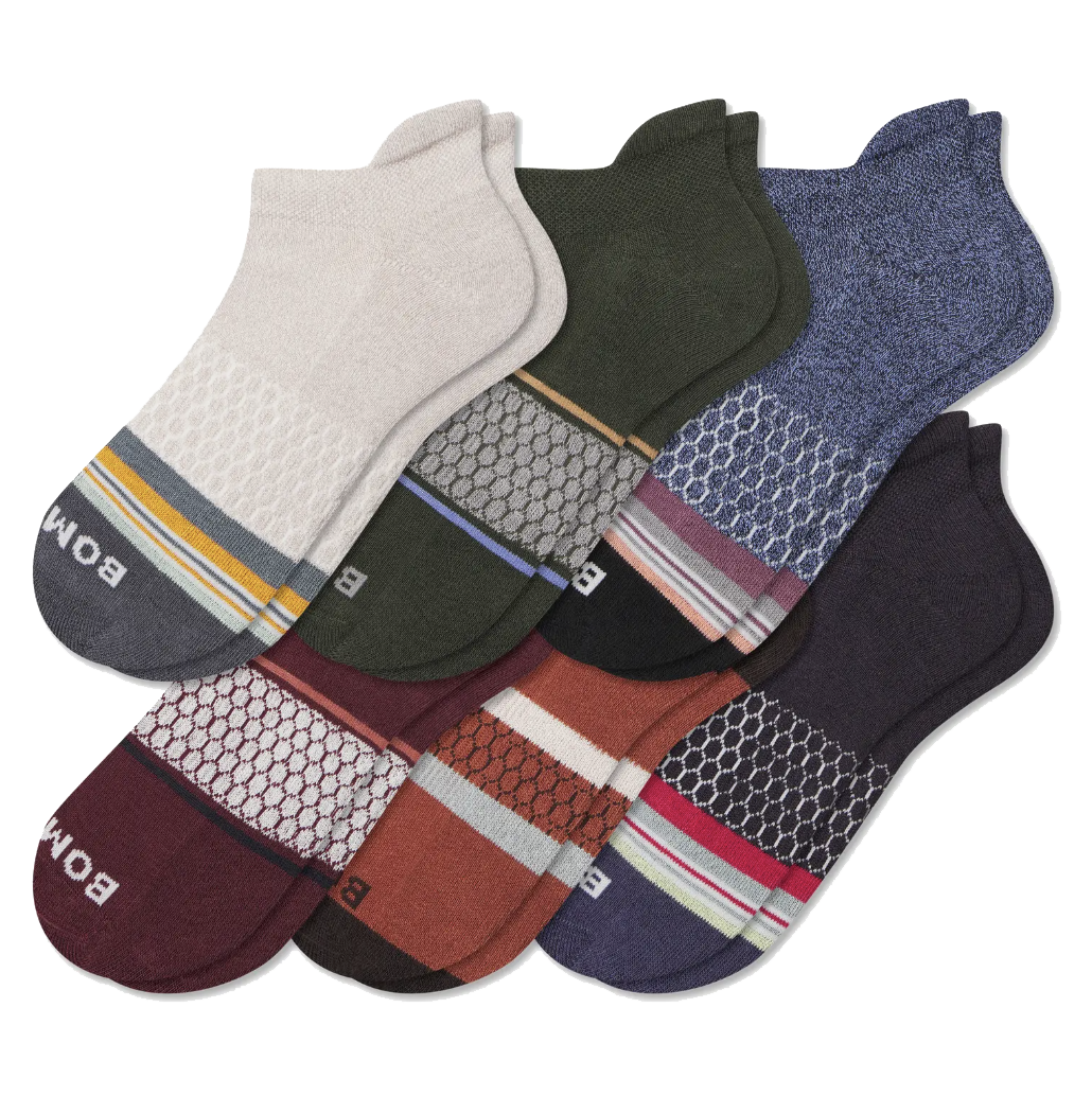 A collection of six multicolored ankle socks featuring different patterns, including stripes and hexagons, with varying color schemes such as beige, green, blue, maroon, orange, and purple.