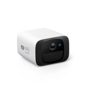 Eufy Wireless 2K Outdoor Camera: A compact, white and black security camera with 2K resolution, designed for outdoor use, featuring a lens on the front and branding on the side.