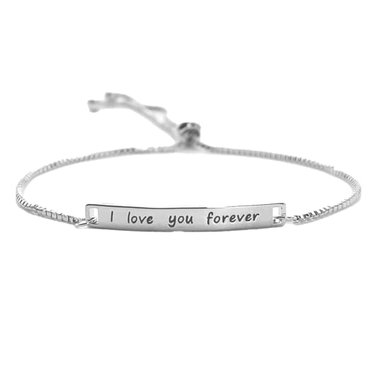 A silver bracelet with a simple chain and an engraved plate reading \“I love you forever.\“