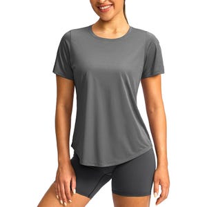 A woman is wearing a gray short-sleeve athletic t-shirt and matching gray shorts, suitable for exercise or casual wear.