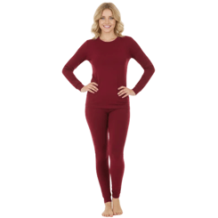 A woman is wearing a long-sleeve, burgundy thermal set consisting of a top and fitted pants.