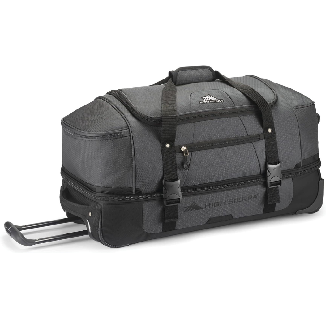 A gray and black rolling duffel bag from High Sierra, featuring a top handle, zippered compartments, and an extendable handle for easy transport.