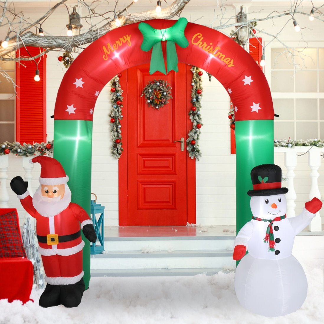 Inflatable Christmas archway with \“Merry Christmas\“ text features Santa and a snowman, suitable for outdoor holiday decorations.