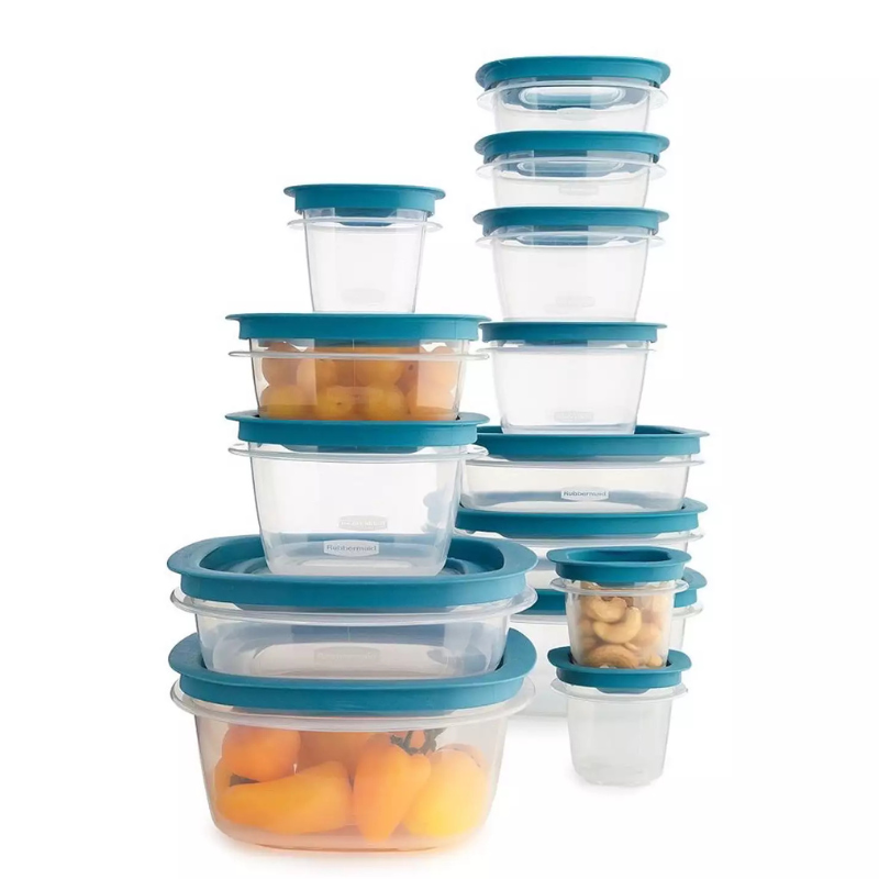 A set of transparent food storage containers with blue lids in various sizes, some containing yellow peppers and cashews.