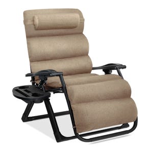 A beige, adjustable recliner chair with a padded design and an attached side tray for holding drinks and small items, supported by a black metal frame.