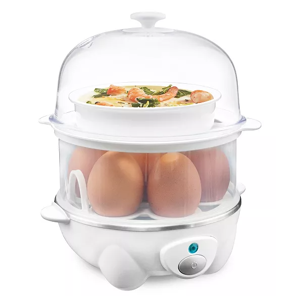 An egg cooker with two tiers displays multiple whole eggs on the bottom and a bowl with a cooked dish topped with shrimp and vegetables on the top.