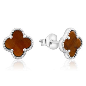 Silver stud earrings featuring four-leaf clover designs with brown stone centers and textured borders.