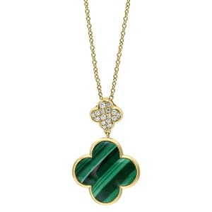 A gold chain necklace featuring a quatrefoil pendant with a green malachite inlay and a smaller, diamond-studded quatrefoil above it.