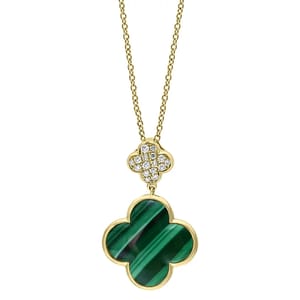 A gold chain necklace featuring a quatrefoil pendant with a green malachite inlay and a smaller, diamond-studded quatrefoil above it.