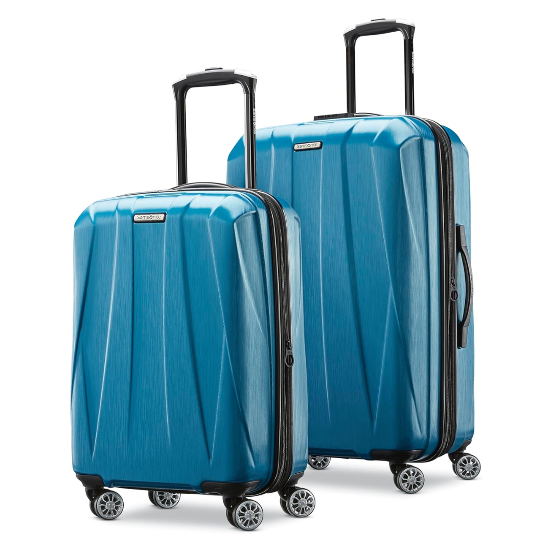 Two blue hard-shell suitcases with telescopic handles and multi-directional spinner wheels, designed for travel.