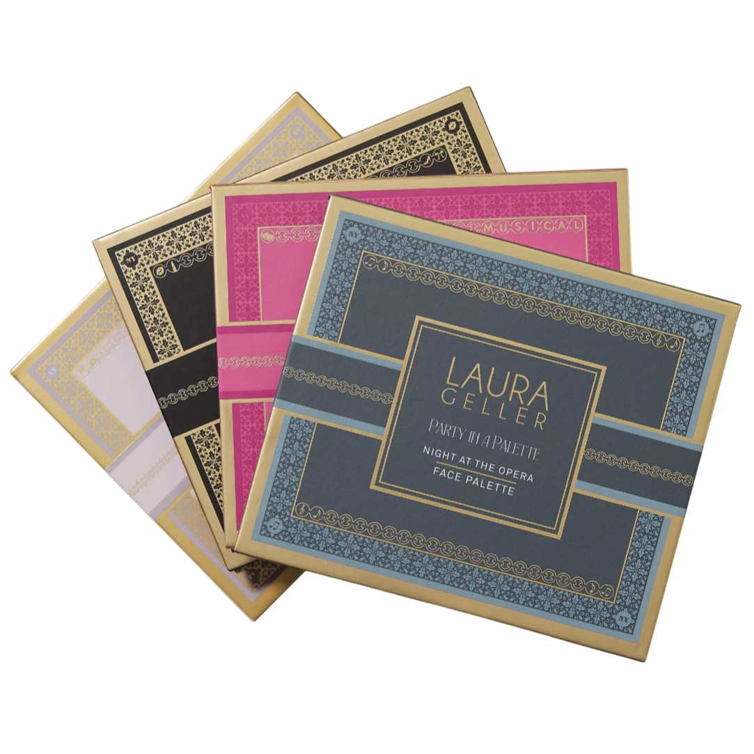 A collection of Laura Geller face palettes titled \“Party in a Palette,\“ with the visible one named \“Night at the Opera.\“ They feature decorative gold and colored designs on the packaging.