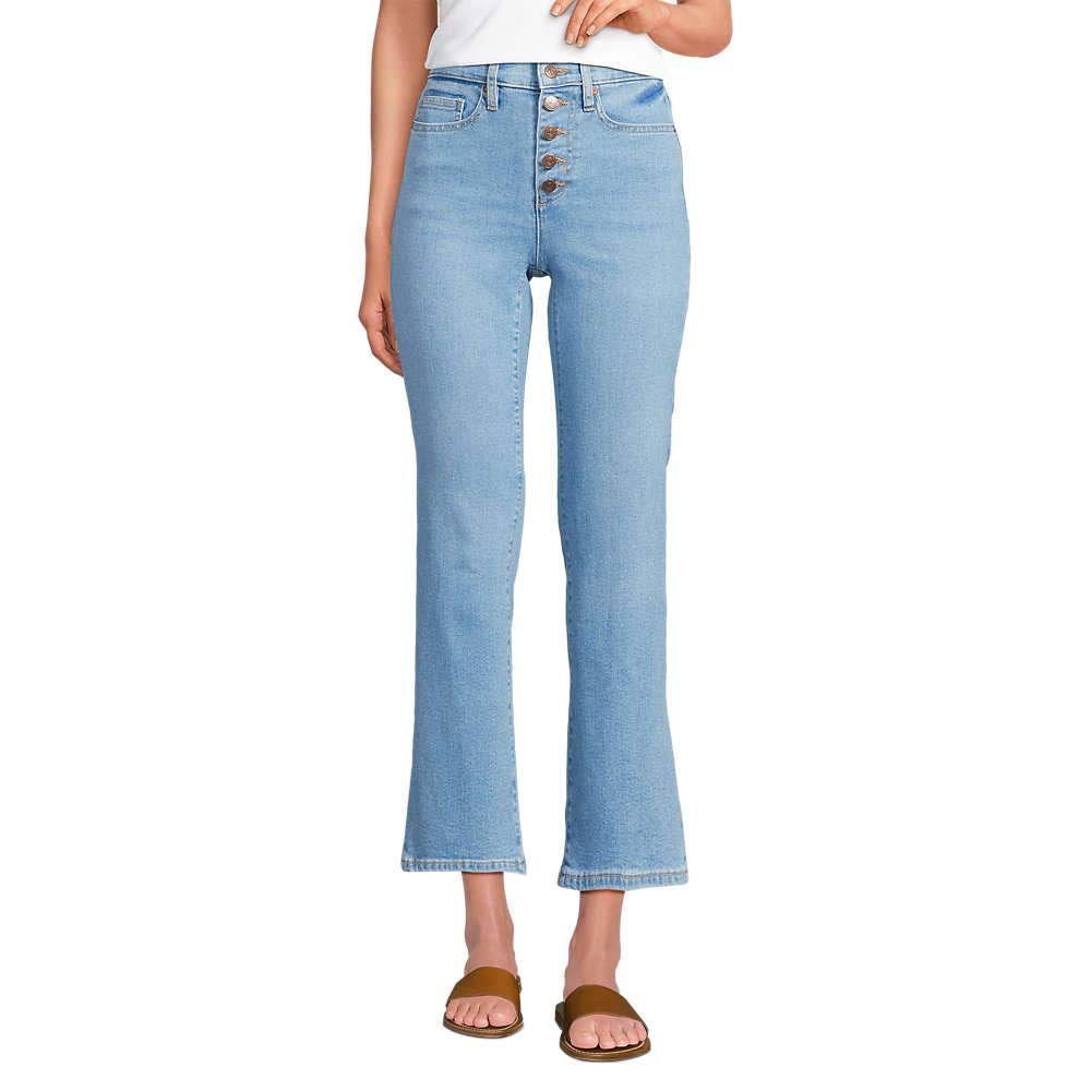 High-waisted, light blue jeans with a button fly and a slight flare at the hem, paired with brown flat sandals.
