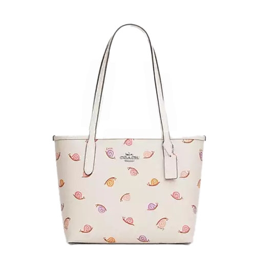 A white tote bag featuring a pattern of colorful snails with long, double straps and a central logo.