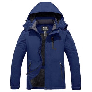 Men's winter coat in dark blue with a detachable hood, front zipper, and multiple zippered pockets, featuring a soft, insulated interior lining for warmth.