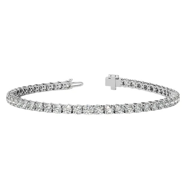 A tennis bracelet featuring a series of round, clear gemstones set in a sleek metal band with a secure clasp.
