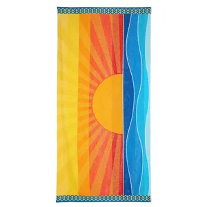 A vibrant beach towel featuring a stylized sun and sea design with yellow, orange, red, and blue tones, bordered by a geometric pattern.