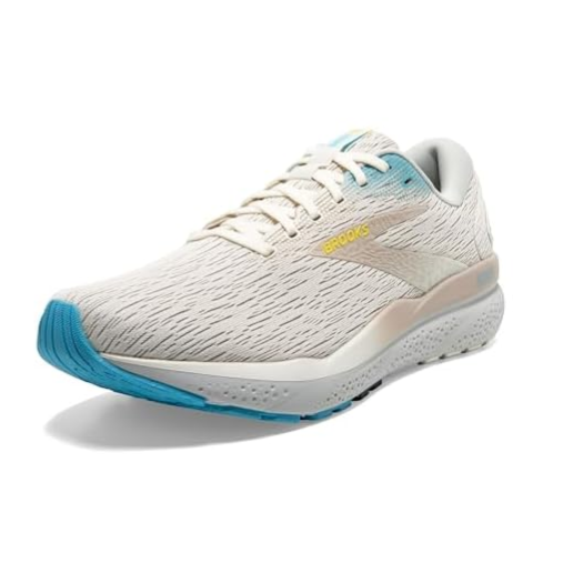 A beige and white running shoe with a textured pattern, featuring a blue sole and yellow branding on the side.