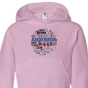 Pink hoodie with a basketball-themed word cloud design centered around the name \“Anderson\“ and the number 44, including words like \“shoot,\“ \“pass,\“ and \“win.\“