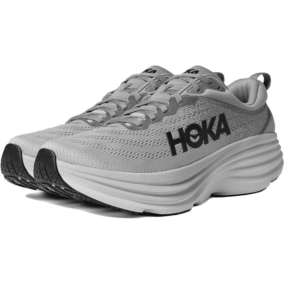 A gray Hoka running shoe with a thick, white midsole and black branding on the side.