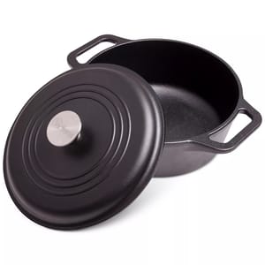 Black cast iron Dutch oven with a lid and two handles, featuring a round metal knob on top.