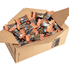 A large box filled with KIND nut bars, featuring colorful packaging with orange star patterns.