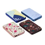 Four portable power banks with USB ports, each featuring different designs: a geometric pattern, a raised floral motif, bright floral prints on a pink base, and dark floral patterns on a maroon base.