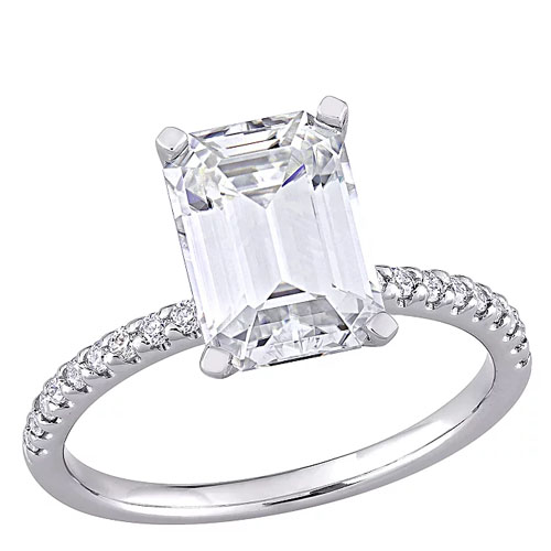 A solitaire engagement ring featuring an emerald-cut diamond with a band adorned with smaller round diamonds.