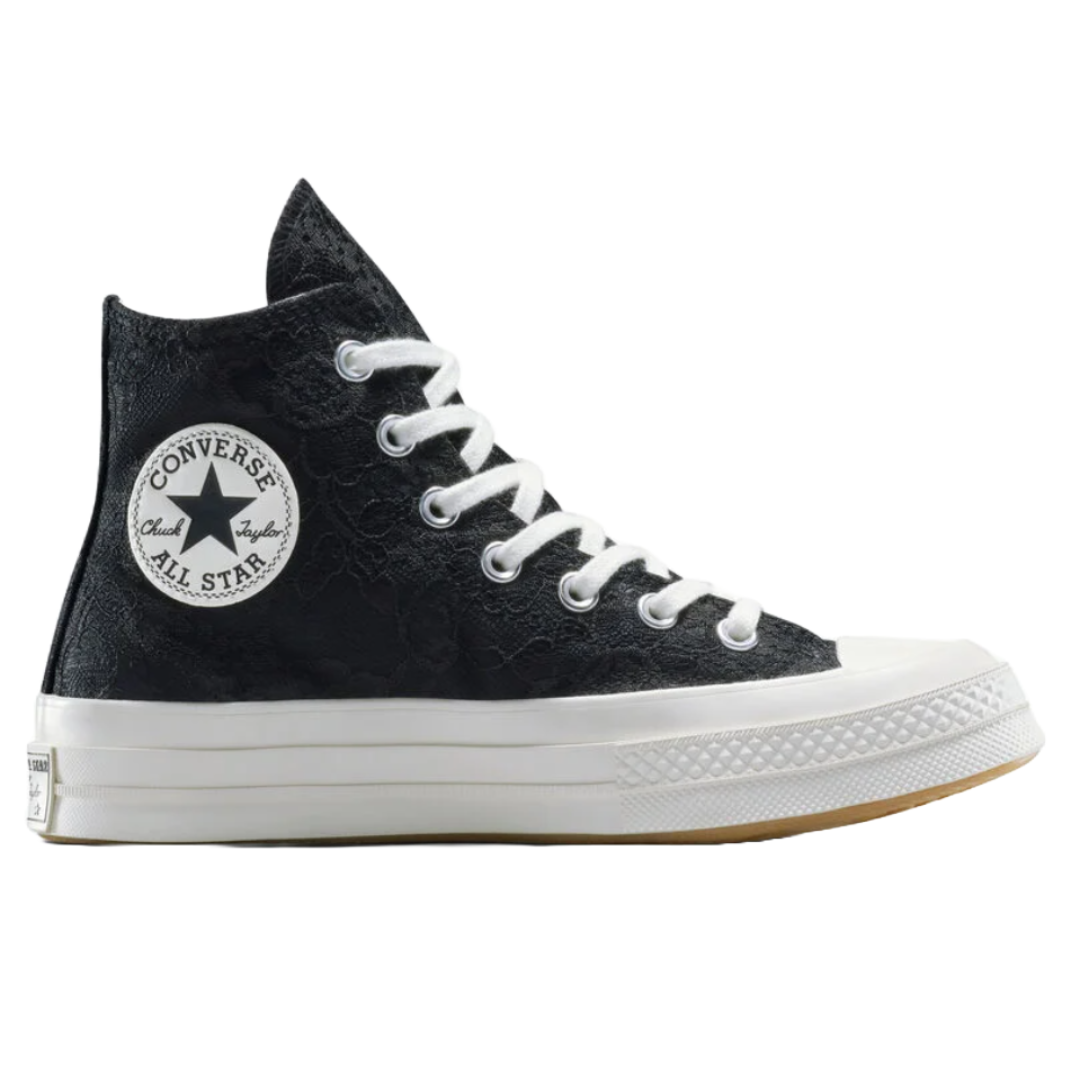 A black Converse Chuck Taylor All Star high-top sneaker with a lace overlay and white rubber sole, featuring white laces and the iconic Converse All Star circular logo on the side.