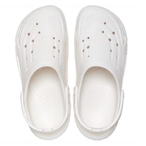 A pair of white rubber clogs with ventilation holes on the top and sides.