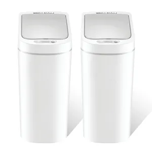 Two sleek white trash bins with touchless lids stand side by side, featuring a modern design with sensor technology for hands-free operation.