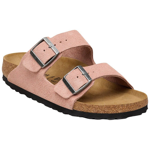 A pink suede sandal with two adjustable buckles, cork footbed, and black rubber sole.
