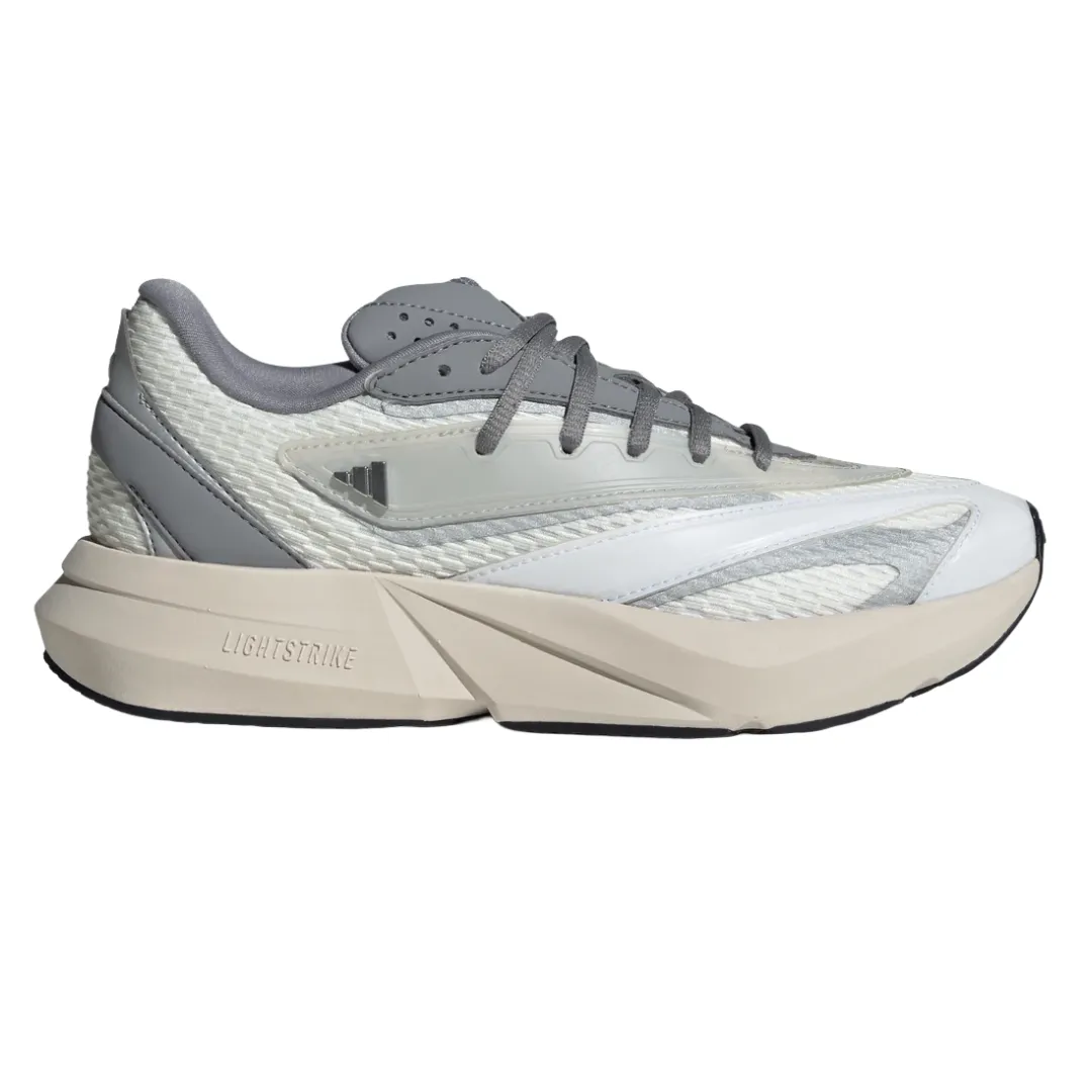 A grey and white sneaker with a chunky sole featuring \“Lightstrike\“ cushioning technology. It has a textured upper with mixed materials and lace-up closure.