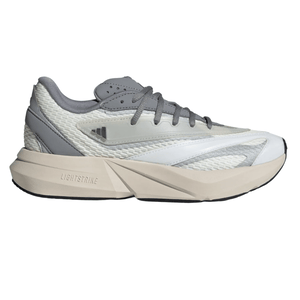 A grey and white sneaker with a chunky sole featuring \“Lightstrike\“ cushioning technology. It has a textured upper with mixed materials and lace-up closure.