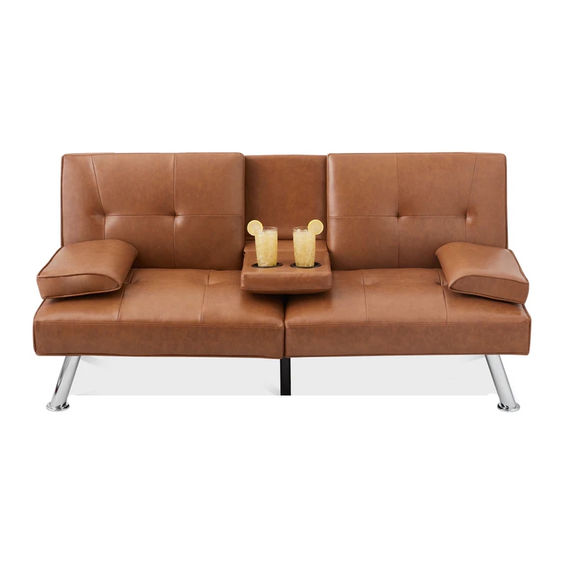 A brown leather-look futon sofa with adjustable armrests and a center tray featuring two cup holders with drinks, supported by shiny metal legs.