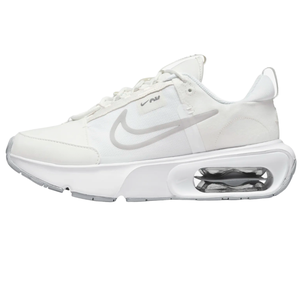 Nike Air Max sneakers in white with a visible air unit in the sole and a grey swoosh logo.