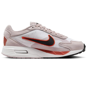 Nike Air Max sneaker with a white mesh upper, beige suede overlays, red and black swoosh, and a white sole with red and black accents.