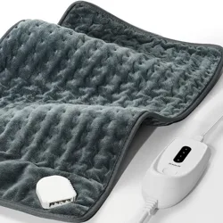 A gray heating pad with a textured surface and an attached white controller featuring multiple heat settings.